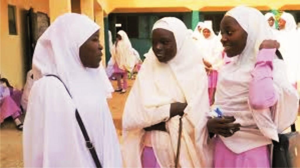 Nigerian girls exchanging pleasantries at school rural school, amidst safety, and poverty