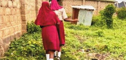 Nigerian girls walking to school in rural areas, facing challenges of distance, safety, and poverty